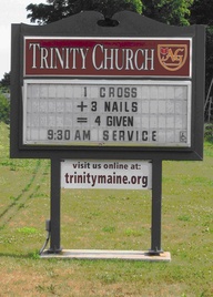 Funny church math on a sign - 1 cross plus 3 nails equals 4 given.